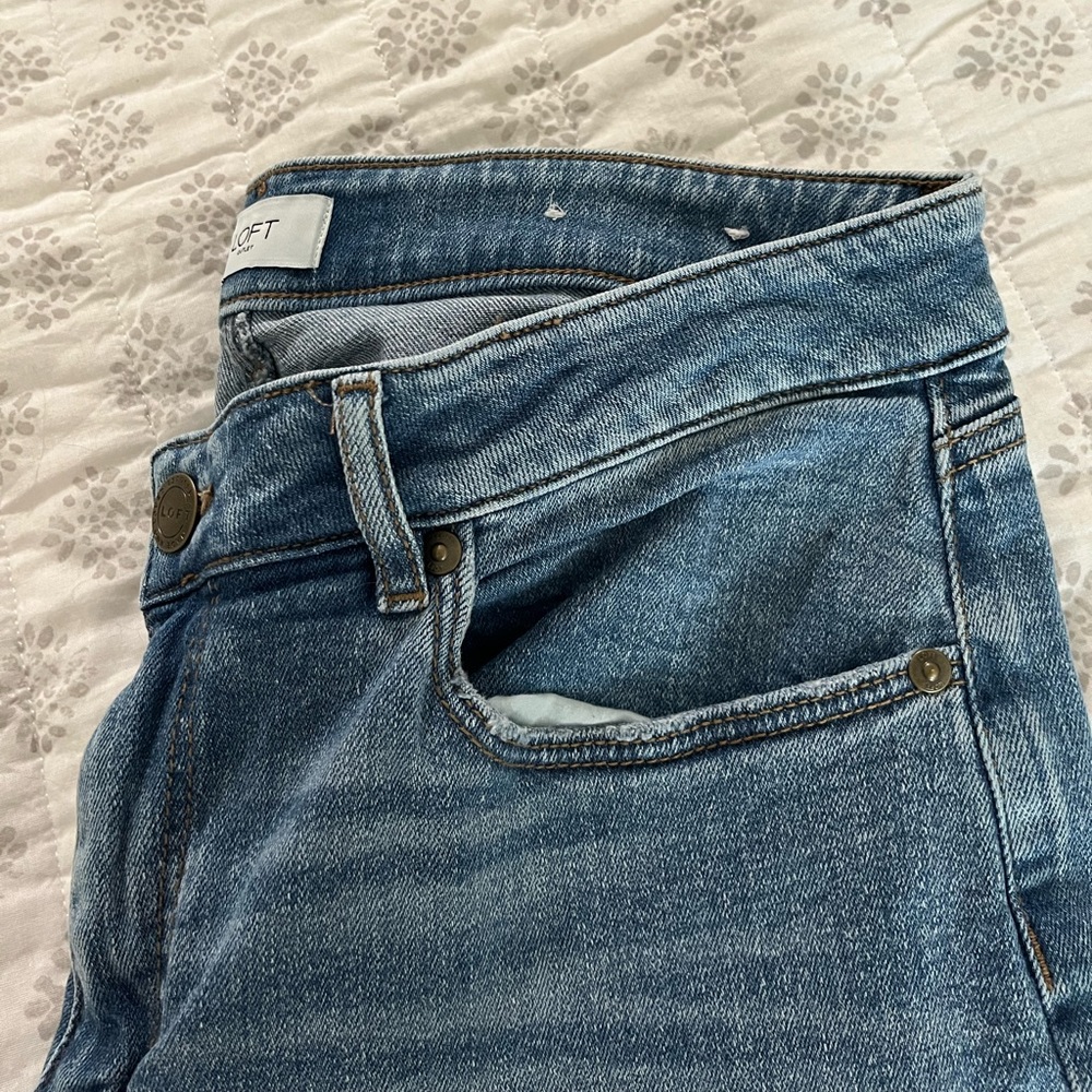 Loft size 10 curvy skinny ankle , hole in knee